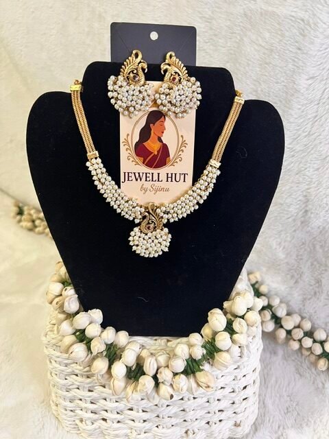 Peacock design pearl necklace with matching earrings